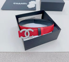 Chanel leather belt in red with silver-tone CC buckle and black keeper stripe.
