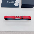 Chanel red leather belt with silver-tone CC buckle and black strap trim.