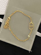 Gold-tone chain bracelet with oval Dior D charm and toggle clasp