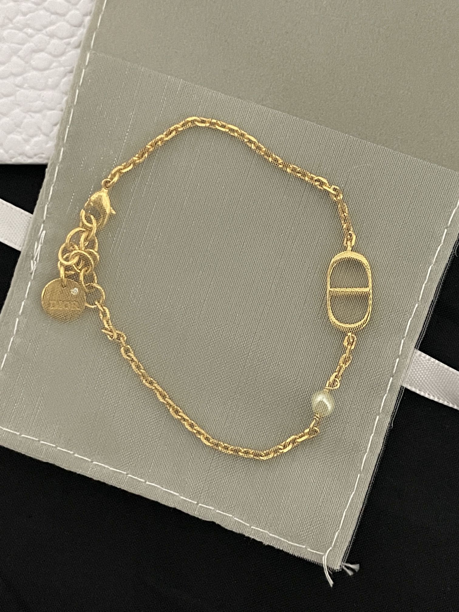 Gold-tone chain bracelet with oval Dior D charm and toggle clasp