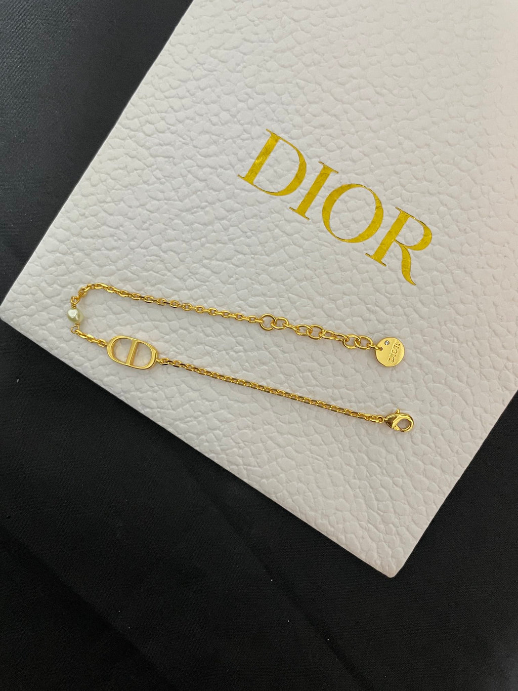 Gold-tone chain bracelets with Dior CD bar charm and small loop ends