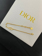 Gold-tone chain bracelets with Dior CD bar charm and small loop ends