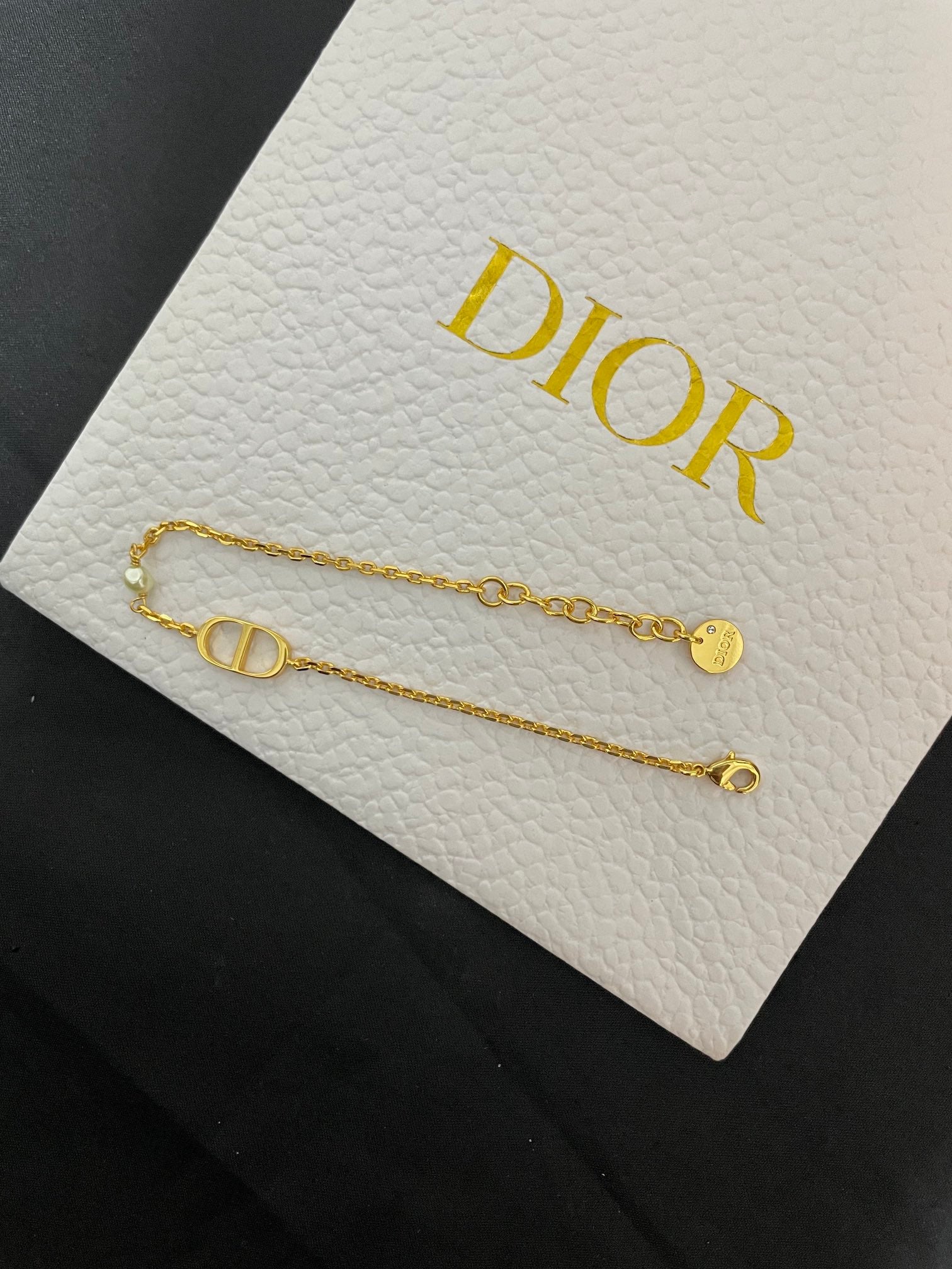 Gold-tone chain bracelets with Dior CD bar charm and small loop ends