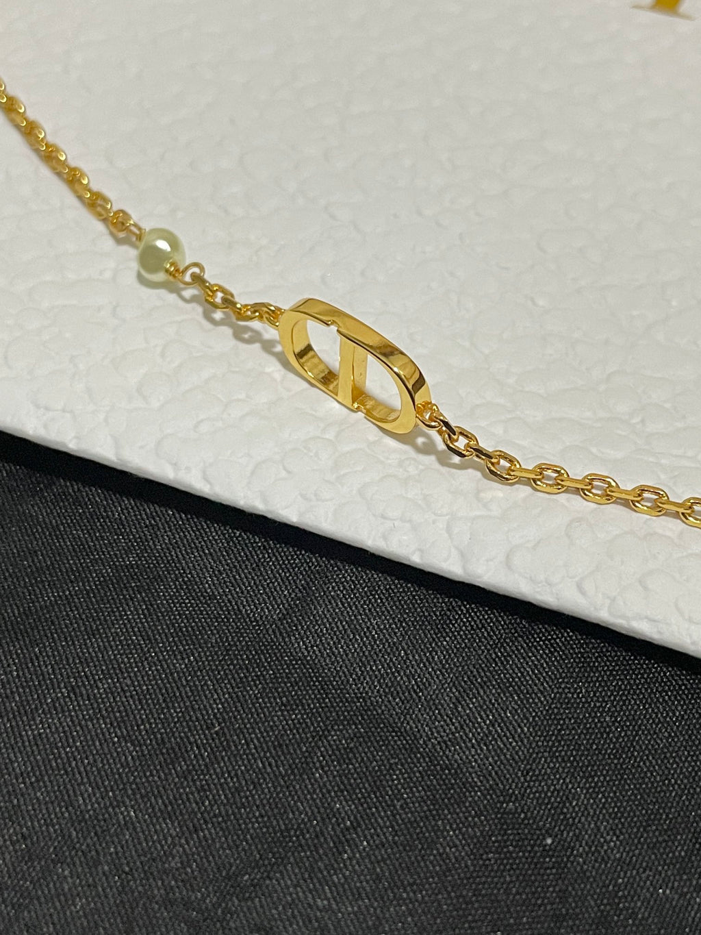 Gold-tone chain necklace with elongated Dior logo pendant and bead accents