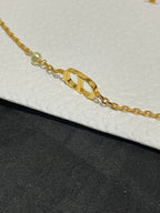 Gold-tone chain necklace with elongated Dior logo pendant and bead accents