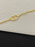 Gold-tone chain bracelet with oval Dior D medallion charm