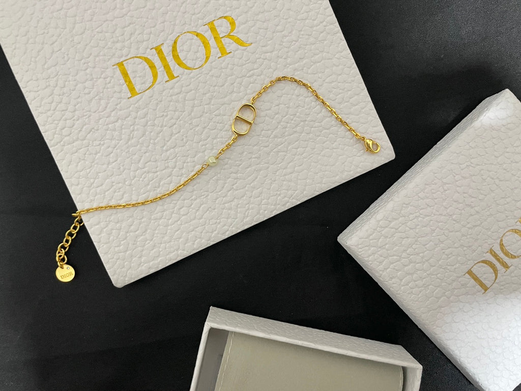 Gold-tone pendant necklace with Dior D charm and small drop charm