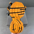 Balenciaga unisex chunky sneakers, orange rubber outsole tread with black sidewalls