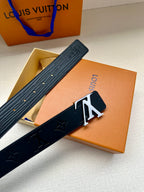 Louis Vuitton belt folded view in dark blue, textured strap with gold-tone LV buckle.