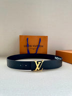 Louis Vuitton belt in dark blue with embossed monogram and gold-tone buckle.