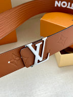 Louis Vuitton brown belt detail with embossed monogram leather and silver-tone buckle