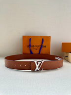 Louis Vuitton leather belt in brown with embossed pattern and silver-tone LV buckle