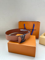 Monogram leather belt with dark LV buckle on box and dust bag