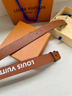 Monogram leather belt detail with embossed LV pattern and pin holes
