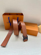 Monogram leather belt with large dark LV buckle, boxes, and strap length