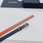 Chanel belt detail: tan strap with dark underside and ornate gold-tone CC star buckle