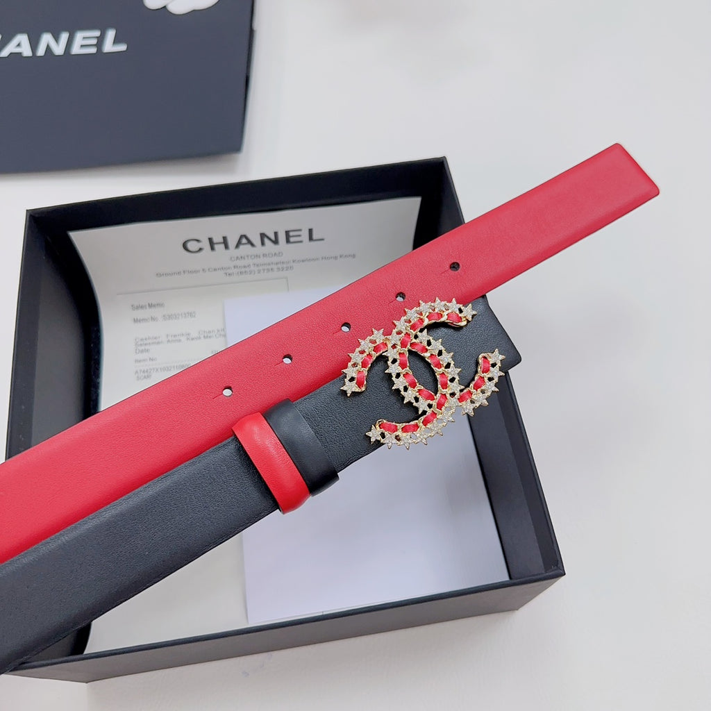 Red leather belt with black inlay and jeweled logo buckle, pin-hole row