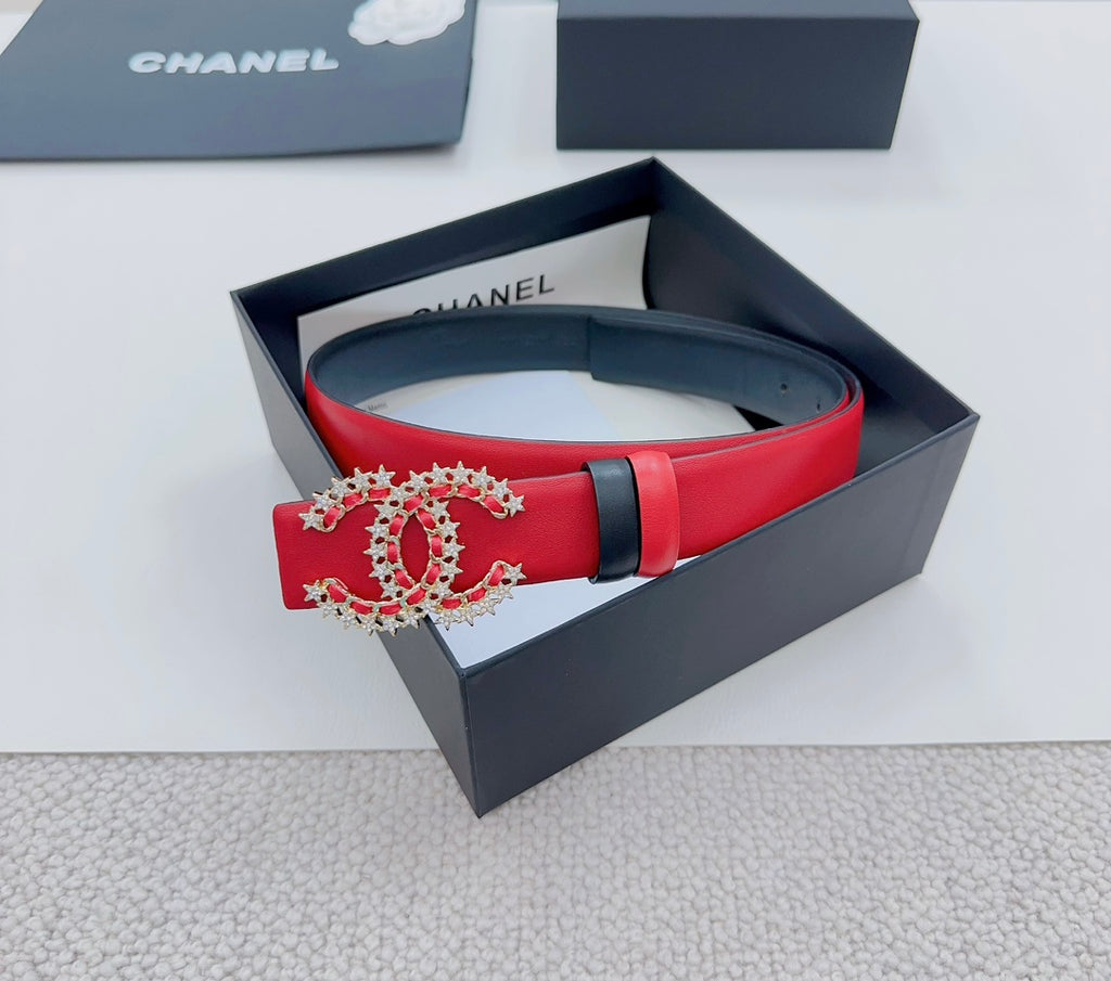 Chanel leather belt with red strap, black trim, and jeweled logo buckle