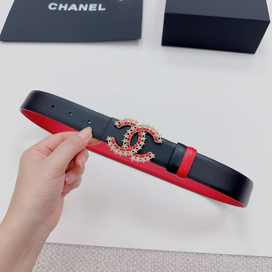 Black leather belt with red underside and jeweled logo buckle