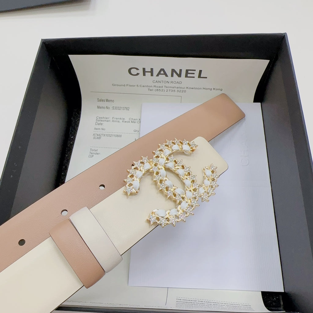 Beige leather belt with gold-tone jeweled buckle, shown inside a gift box set.
