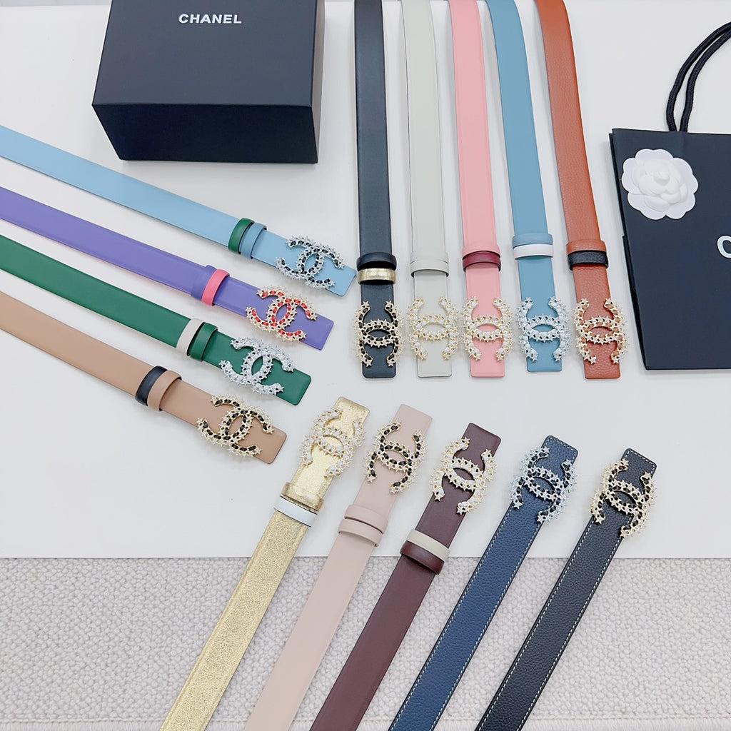 Embellished Chanel belts assortment with colorful straps and gold-tone stone buckles.