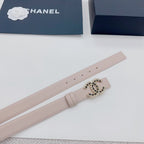 Chanel belt light beige close-up, slim strap with gold-tone logo buckle.
