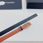 Orange leather belt with dark strap and floral metal buckle detail on side view