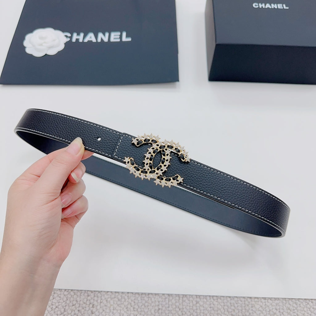 Navy leather belt, shown flat, with gold-tone logo buckle centerpiece