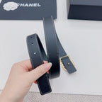 Navy leather belt with gold-tone buckle and visible strap thickness and stitching