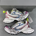 Balenciaga unisex sneakers with white uppers, blue/red/pink trim, neon green laces