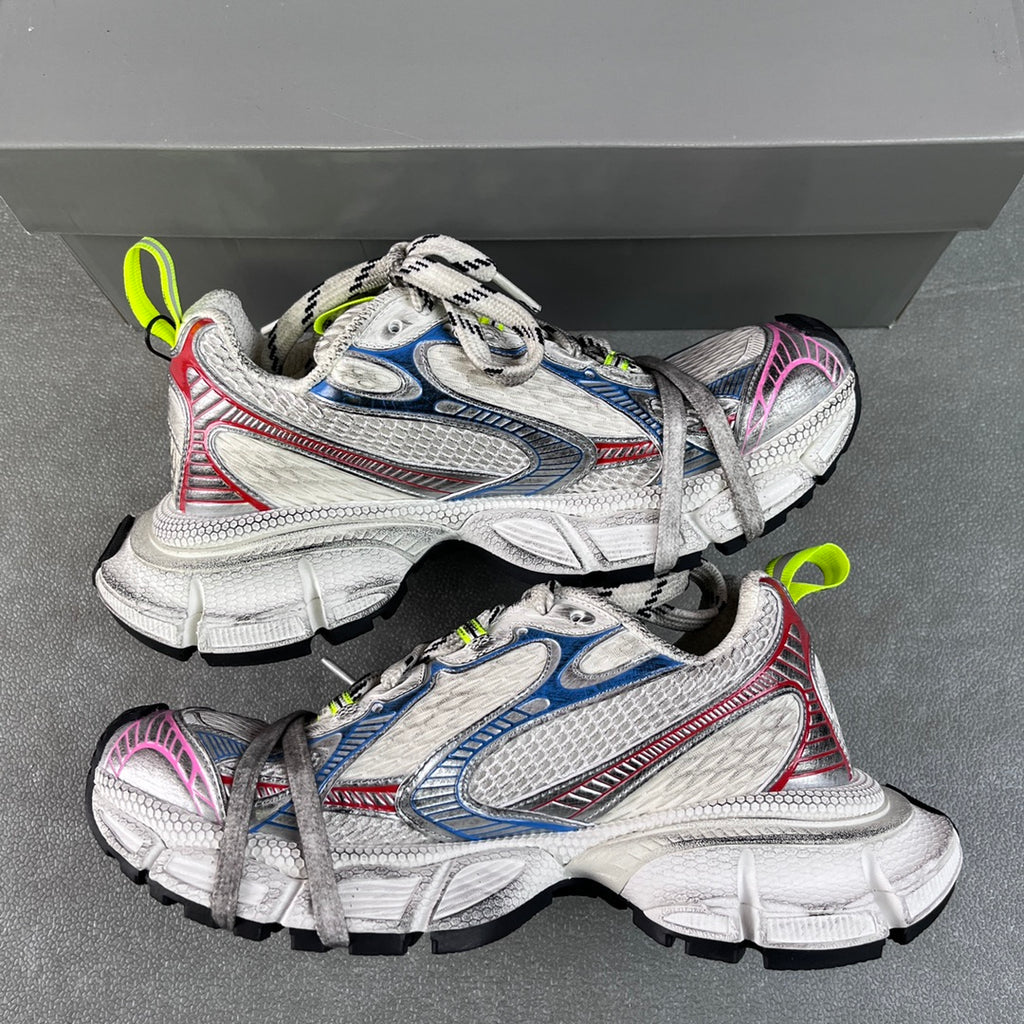 Unisex sneakers angled view, white uppers with blue/red/pink trim and neon green laces