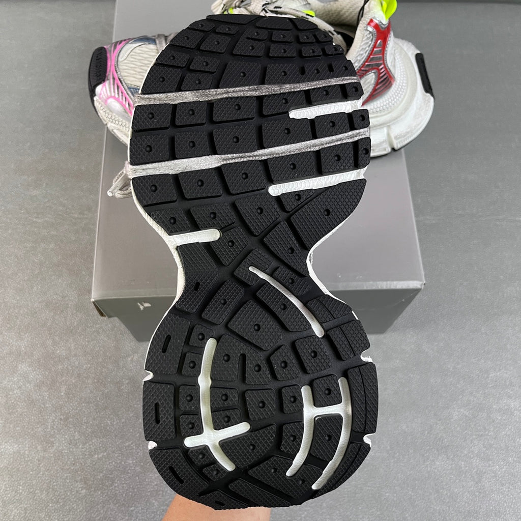 Unisex sneaker outsole view, chunky black tread with white midsole