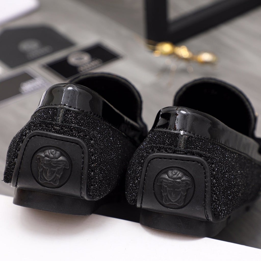 Versace black loafers, rear view with embossed medallion and rubber sole