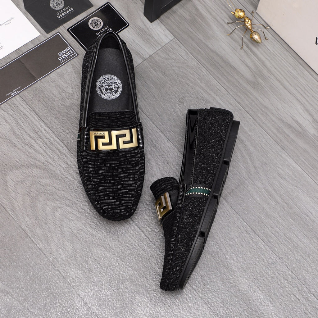 Versace black textured loafers with gold buckle and teal-trim side accents