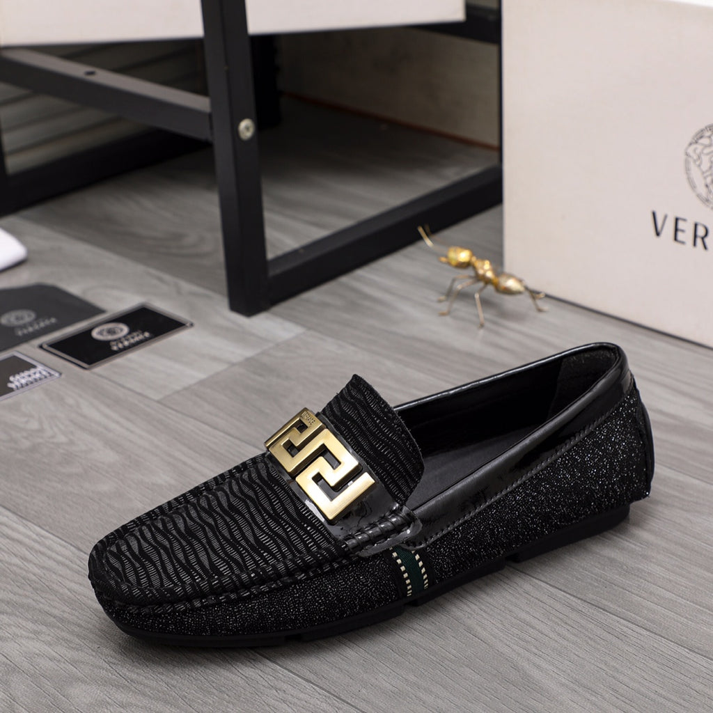Versace black textured loafers with gold square emblem buckle and slip-on design