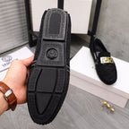 Versace black loafer outsole with embossed Greca border and Medusa emblem