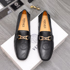 Versace leather loafers in black with gold-tone buckle and embossed medallion