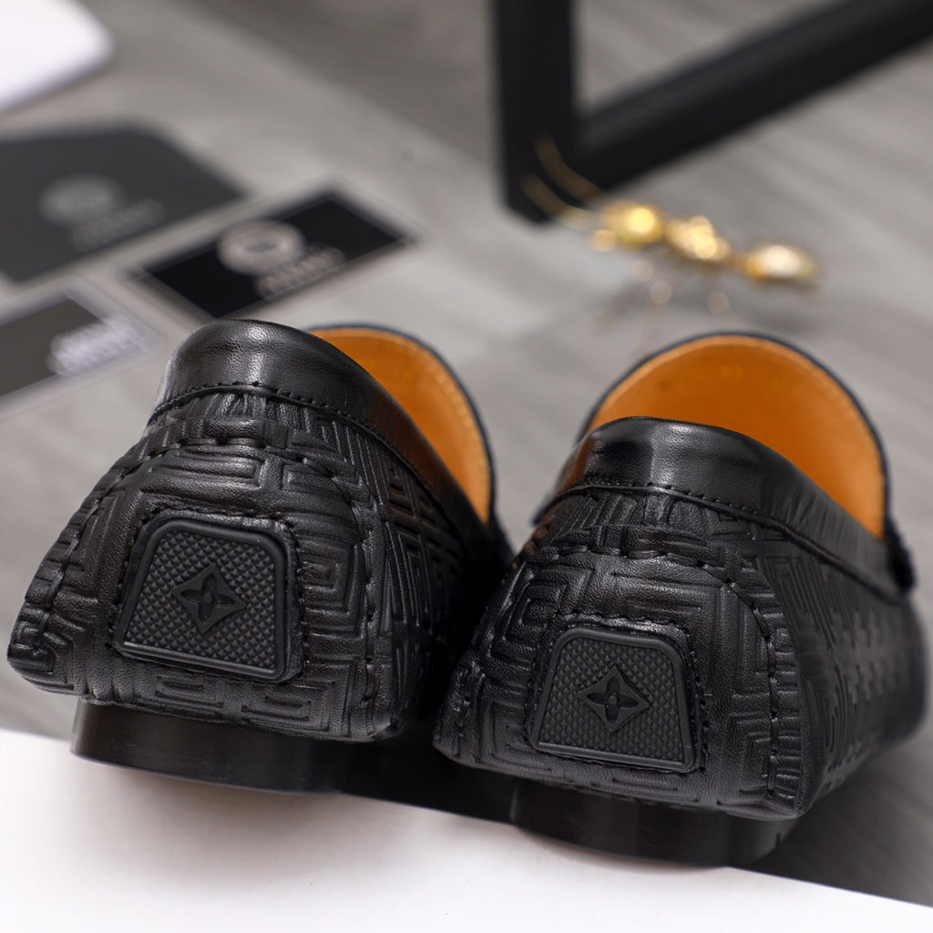 Versace luxury shoes, black loafer heels with embossed emblem and textured tread