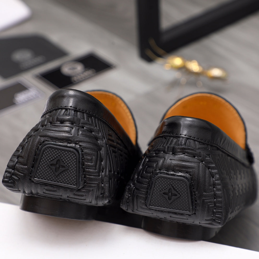 Versace luxury shoes, black loafer heels with embossed emblem and textured tread