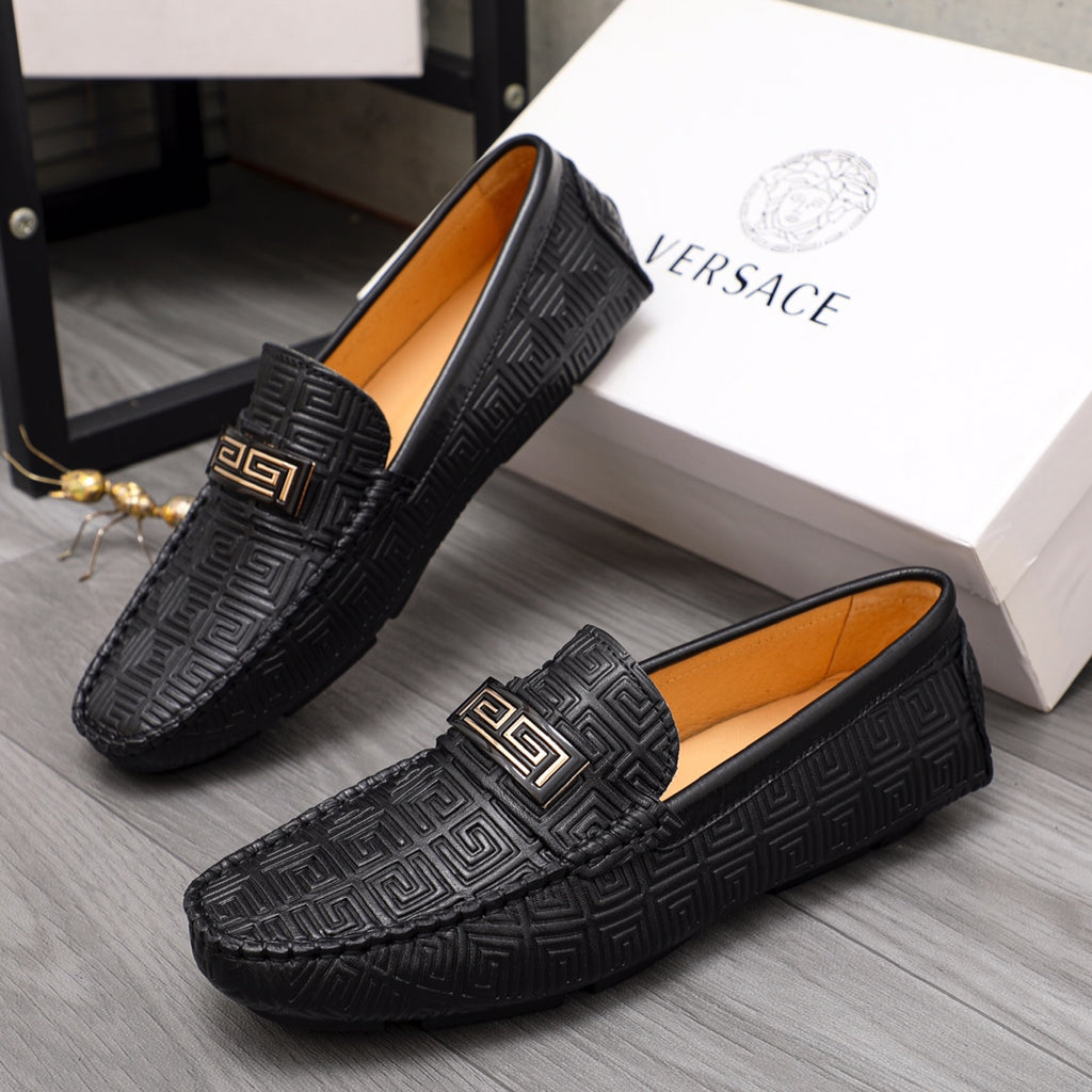 Versace luxury shoes, black loafers with embossed pattern and gold accent buckle