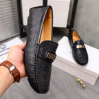 Versace luxury shoes, black loafers with embossed pattern and gold accent buckle