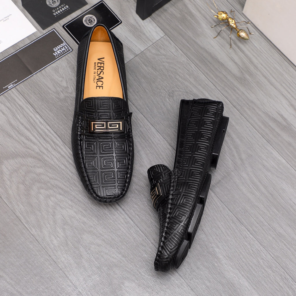 Versace luxury shoes, black loafers shown with side view and embossed pattern