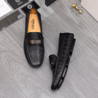 Versace luxury shoes, black loafers shown with side view and embossed pattern