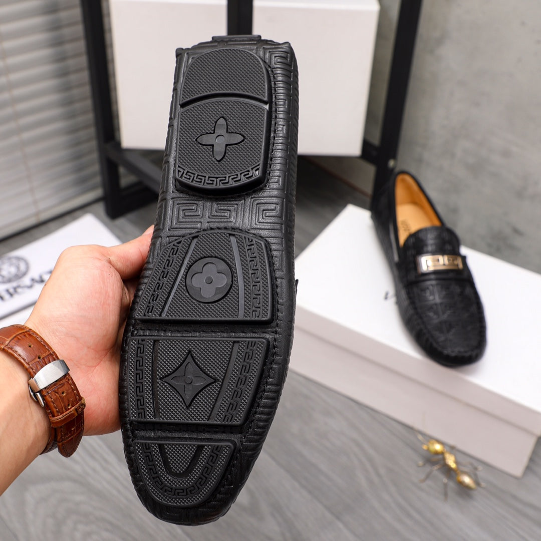 Versace luxury shoes, black loafer outsole with geometric tread and star symbols