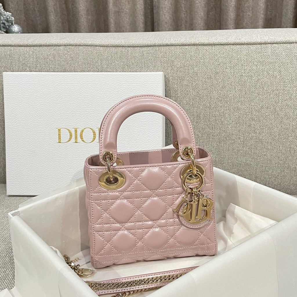 Dior mini handbag in pale pink with quilted pattern and gold-tone top handles