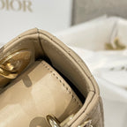 Beige Dior bag interior view with top opening and quilted lining