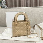 Beige quilted Dior mini bag with top handles and gold-tone chain strap