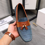 Versace blue leather loafers with orange collar, tassel detail, and stitched edges
