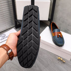 Versace loafer bottom with textured rubber tread and orange trim detail