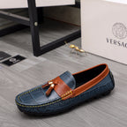 Versace blue slip-on loafers with orange leather band and tassel accent